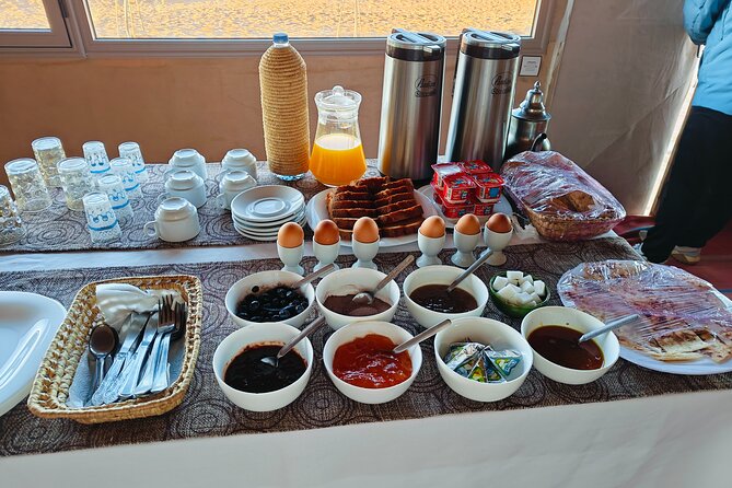 Erg Chebbi Desert Overnight in Tent with Camel Ride & Sandboard - Timing, meeting point, and cancellation details