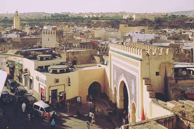 Fes Guided Sightseeing Tour with Luxury Car All Inclusive Tickets - Entering the Medina with a local guide