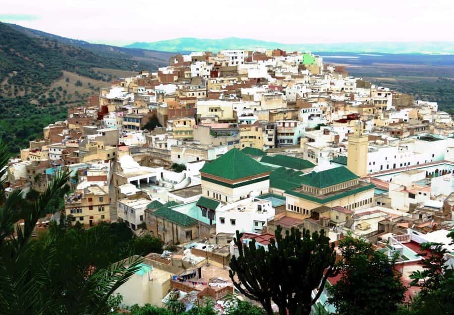 Fes: Volubilis Roman Ruins, Mouly Idriss, & Meknes Day Trip - Leaving Fes in an air-conditioned vehicle