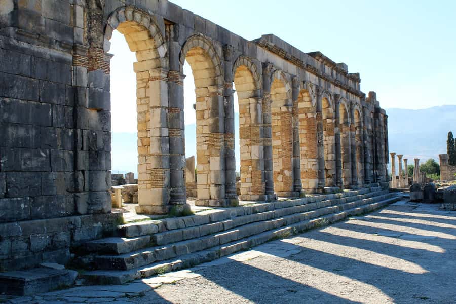From Fez: Volubilis, Moulay Idriss and Meknes Full Day Tour - Volubilis: Roman stones under open sky