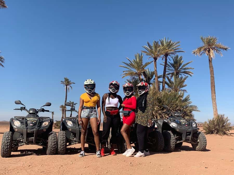 Marrakech: Desert and Palm Grove Sunset Quad Tour with Tea - Riding through palms, rocky tracks, and villages