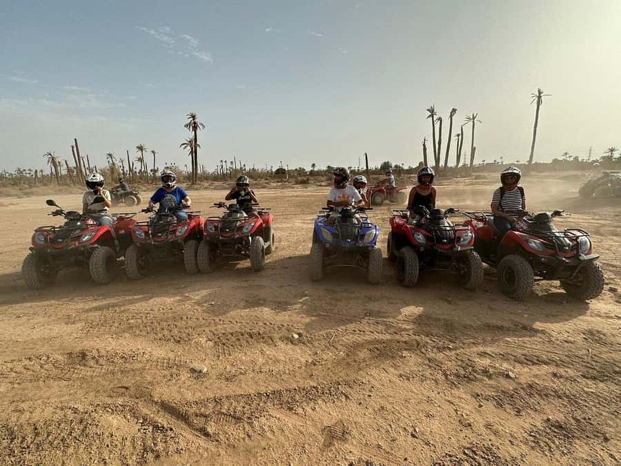 Marrakech: Desert and Palm Grove Sunset Quad Tour with Tea - The sunset photo stop and the dark ride home