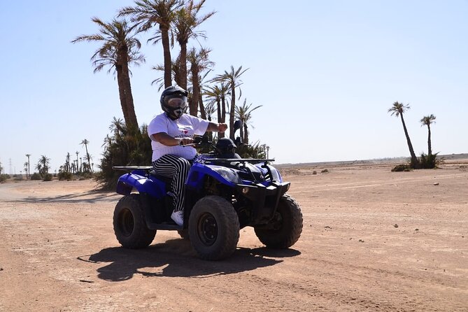 Marrakech Quad Bike Experience with Hotel Pick up and Drop Off - Riding through palms, dust, and rocky tracks