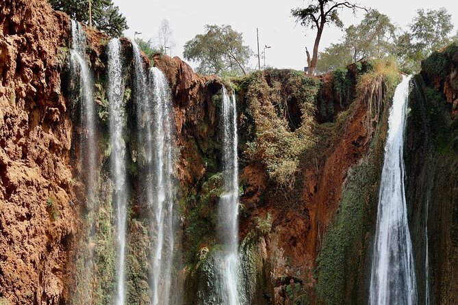 Small group Ouzoud Waterfall Guided Tour Boat Ride from Marrakech - The boat ride beneath the spray